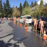 Members of the Mercer Island High School boys water polo team wash cars during the team&rsquo;s annual fundraiser last year. Courtesy photo