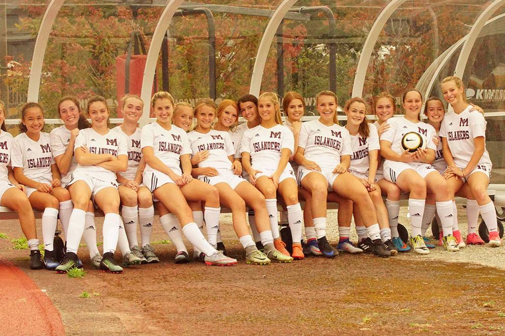 Photo courtesy of Tim Bauman                                Two sideline shelters, which will provide cover from rain and win during Mercer Island High School outdoor sporting events, was recently donated for us at the Mercer Island High School stadium. The Mercer Island Islanders girls varsity soccer team is pictured in the above photo. The primary sponsor of the shelters was the Mercer Island Community Fund, Mercer Island High School girls soccer booster club and the Mercer Island High School boys booster club. Meta Lee is the President of the Mercer Island Community Fund and Dan Riley is the President of the girls soccer booster club. Mercer Island boys soccer head coach Colin Rigby and Mercer Island High School head of maintenance Tony Kuhn were also instrumental in getting the project complete. The shelters are portable and can be moved when not used.