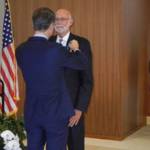 Alan Merkle receives the Chevalier de l&rsquo;Ordre National du Merite on Sept. 15. Photo courtesy of Rich Conrad