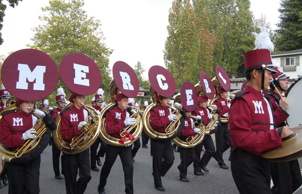 The marching band parades through Town Center. Katie Metzger/staff photo