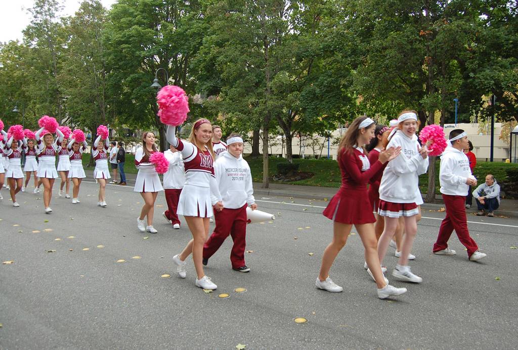 MIHS cheerleaders parade through downtown Mercer Island. Katie Metzger/staff photo