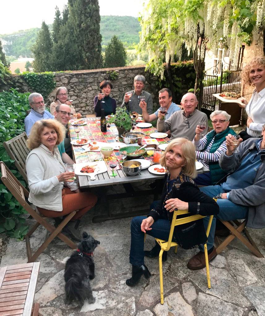 Guests enjoy Ann Lokey&rsquo;s backyard patio in the village of St Cirq Lapopie. Photo courtesy of Ann Lokey
