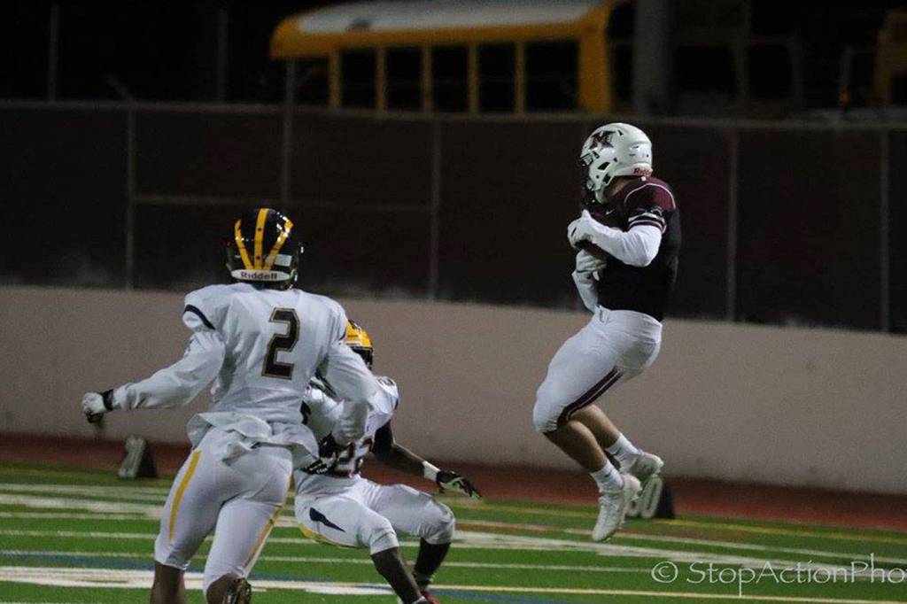 Photo courtesy of Don Borin/Stop Action Photography                                Mercer Island wide receiver Cole Miller hauls in a 73-yard reception from quarterback Nikhil Nayar in the second quarter of play. Bellevue defeated Mercer Island 40-7 on Oct. 13.