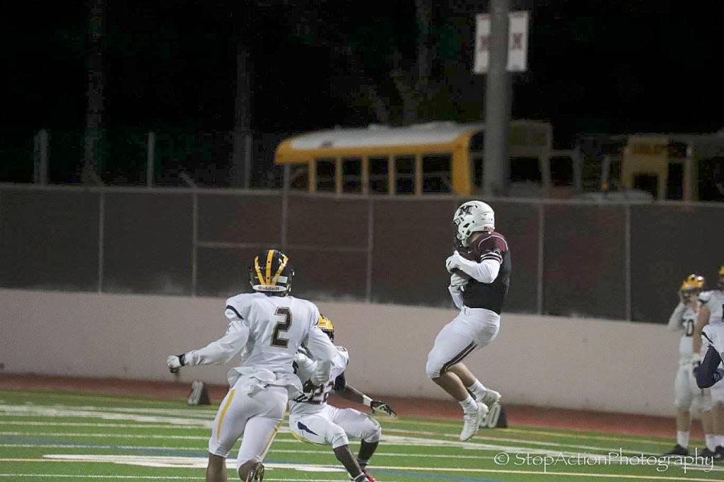 Photo courtesy of Don Borin/Stop Action Photography                                Mercer Island wide receiver Cole Miller hauls in a 73-yard reception from quarterback Nikhil Nayar in the second quarter of play. Bellevue defeated Mercer Island 40-7 on Oct. 13.