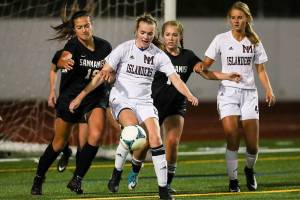 Photo courtesy of Rick Edelman/Rick Edelman Photography                                The Mercer Island Islanders girls soccer team captured a 2-0 win against the Interlake Saints on Oct. 17. The Islanders have an overall record of 10-1-1 and are in first place in the KingCo 3A/2A division. Liberty is in second place with a record of 9-2-1. Mercer Island player Kendall Riley (pictured) gains control of the ball in a game against the Sammamish Totems on Oct. 10. Mercer Island will host the Redmond Mustangs in their final regular season home game of the 2017 season at 7:30 p.m. on Oct. 24 at Mercer Island High School.