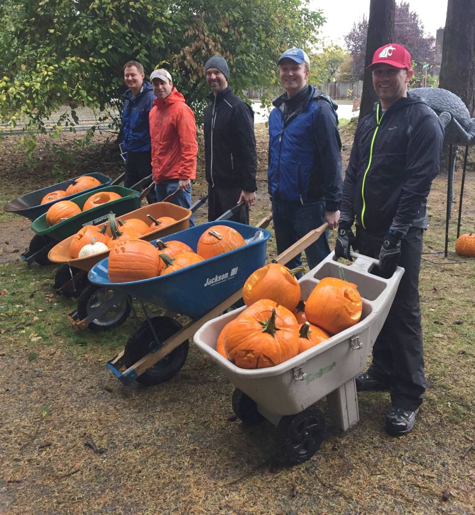 Volunteers Eric Robinson, Jason Schauer, Clay Colburn, Dave Vavrichek and Coleman Brown get ready to help arrange the pumpkins along the trail. Photo courtesy of Amanda Colburn