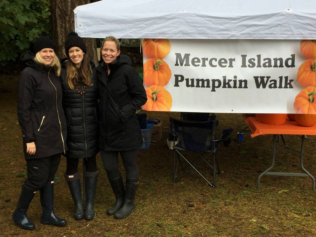 Organizers Lindsey Holt, Amanda Colburn and Kau&rsquo;ilani Robinson pose next to the sign for the event. Photo courtesy of Amanda Colburn