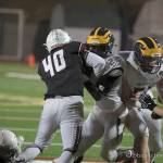 Photo courtesy of Don Borin/Stop Action Photography                                Mercer Island middle linebacker William Mulflur (No. 40) tackles Bellevue running back Isaiah Ifanse in a contest between rivals on Oct. 13. Mulflur landed a job in the starting lineup in his first-ever season of high school football during the 2017 season.