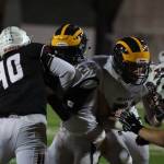 Photo courtesy of Don Borin/Stop Action Photography                                Mercer Island middle linebacker William Mulflur (No. 40) tackles Bellevue running back Isaiah Ifanse in a contest between rivals on Oct. 13. Mulflur landed a job in the starting lineup in his first-ever season of high school football during the 2017 season.