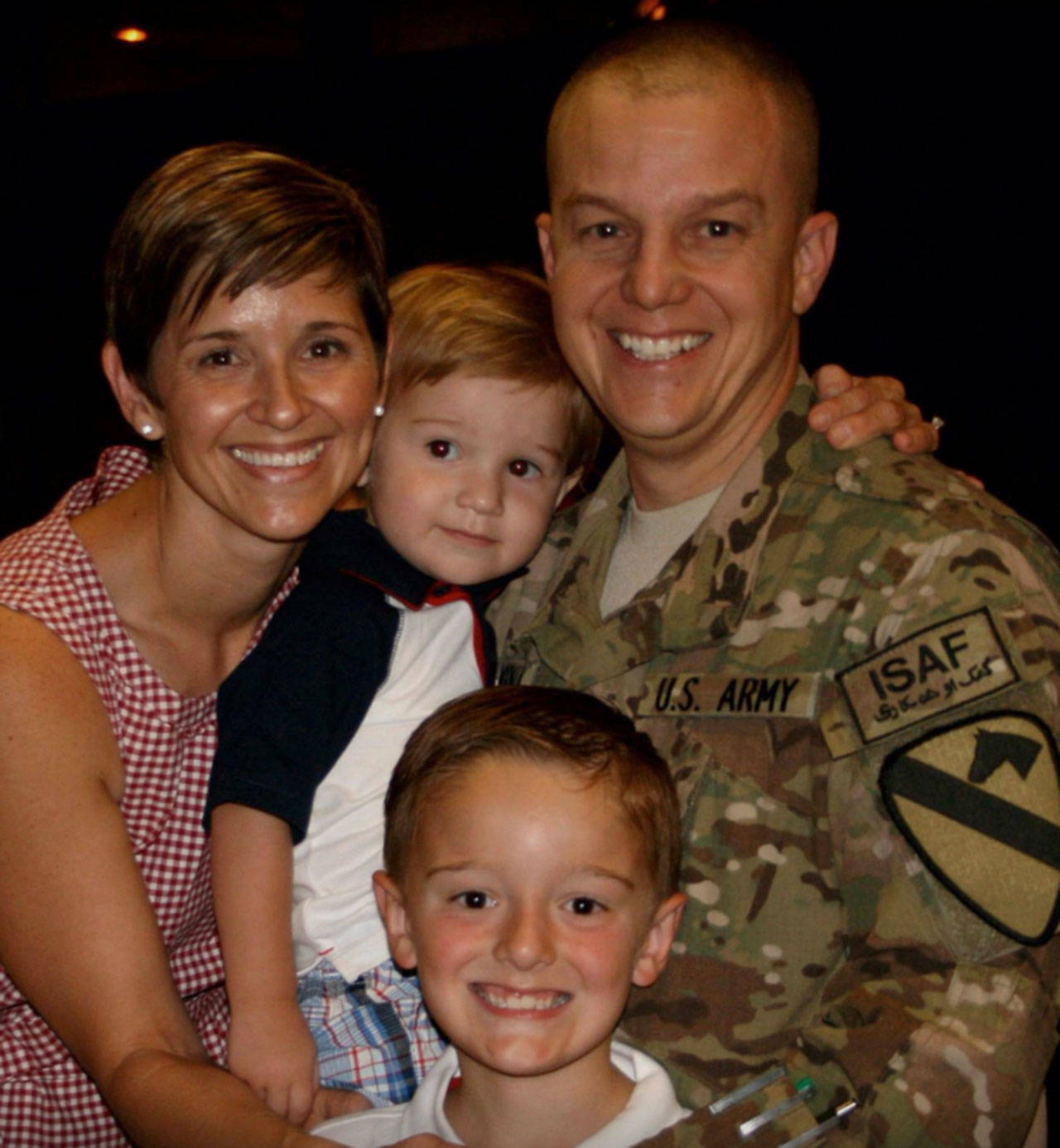 U.S. Army LTC Geoffrey Norman smiles with his wife Stephanie and sons William and Ben. Normans sister, Islander Hilary Benson, said she wishes people knew how incredibly much sacrifice military spouses and children make. Photo courtesy of Hilary Benson