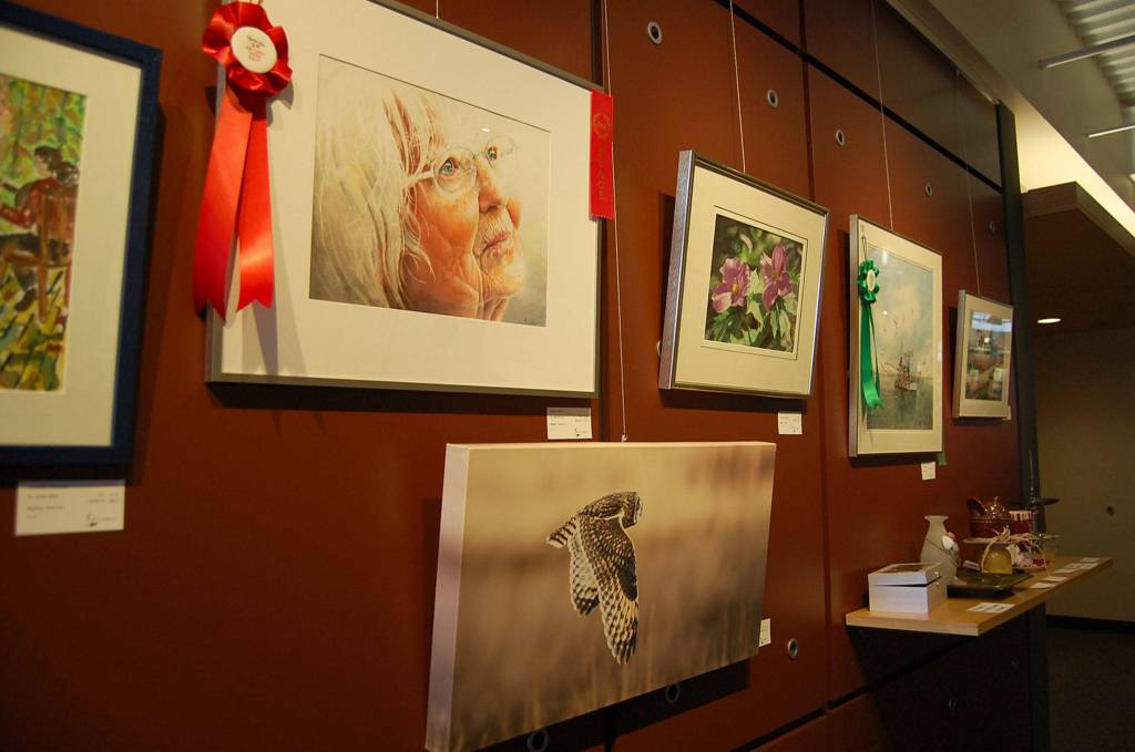 The exhibit features many artists, including Ron Reeder (first place), Seiko Konya (second) and Nora Lenz (third). The show was judged by watercolorist Tom Hoffmann.