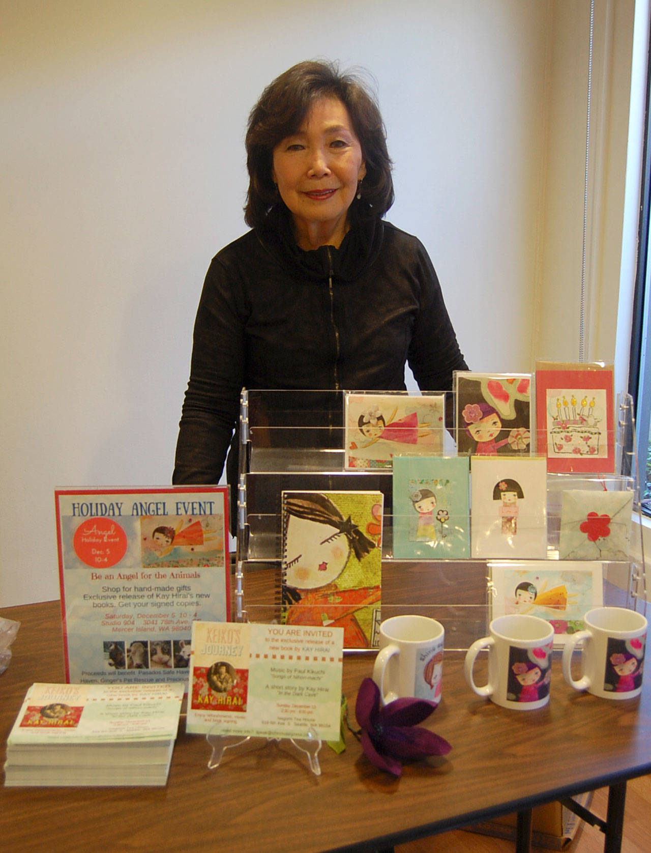 Kay Hirai poses with her handmade artwork before her holiday Angel for Animals event in 2015. File photo
