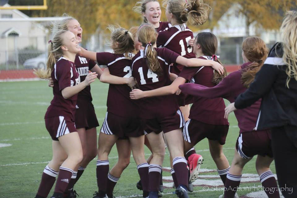 Photo courtesy of Don Borin/Stop Action Photography                                Mercer Island girls soccer players celebrate near the sidelines after the final whistle of the Class 3A state title game.
