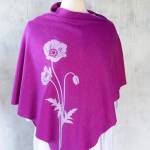 Seattle artist Shino Mikamis eco-friendly womens poncho made of hemp/organic cotton jersey displays a picture of poppy flowers screen-printed on the front. Courtesy of the artist