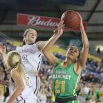 Photo courtesy of Don Borin/Stop Action Photography                                Mercer Island girls basketball player Claire Mansfield, left, leaps into the air while playing defense in the Class 3A state championship game in March 2017.