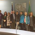 Newly sworn in Mercer Island City Council member Tom Acker poses with family, friends and supporters on Nov. 28. Photo courtesy of Traci Granbois