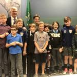 Tom Acker poses with his three sons and other Mercer Island kids after being ceremoniously sworn in to the City Council on Dec. 5. Photo courtesy of Julie Underwood