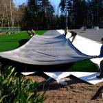 Crews stretch out rolls of all-weather turf for the Island Crest Park sportsfield improvement project. Photo courtesy of the city of Mercer Island