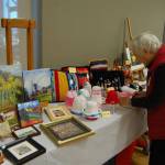 The meeting room in the Mercer Island Community and Event Center was lined with tables of handmade art pieces and gifts on Dec. 7. Katie Metzger/staff photo