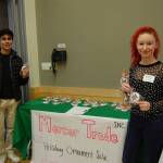 Students from the MIHS Social Enterprise Group sell holiday ornaments. Katie Metzger/staff photo