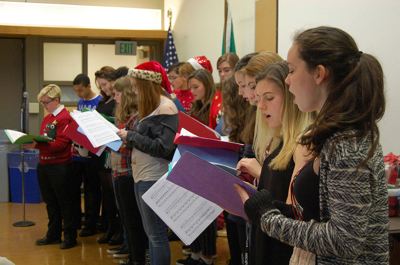 Students from Daniela Melgars drama class at Mercer Island High School perform holiday carols at the Chamber of Commerces December luncheon. Katie Metzger/staff photo