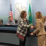 Superintendent Donna Colosky shakes Deborah Schneider Luries hand after swearing her into Position 4 on the Mercer Island School Board on Dec. 14. Katie Metzger/staff photo
