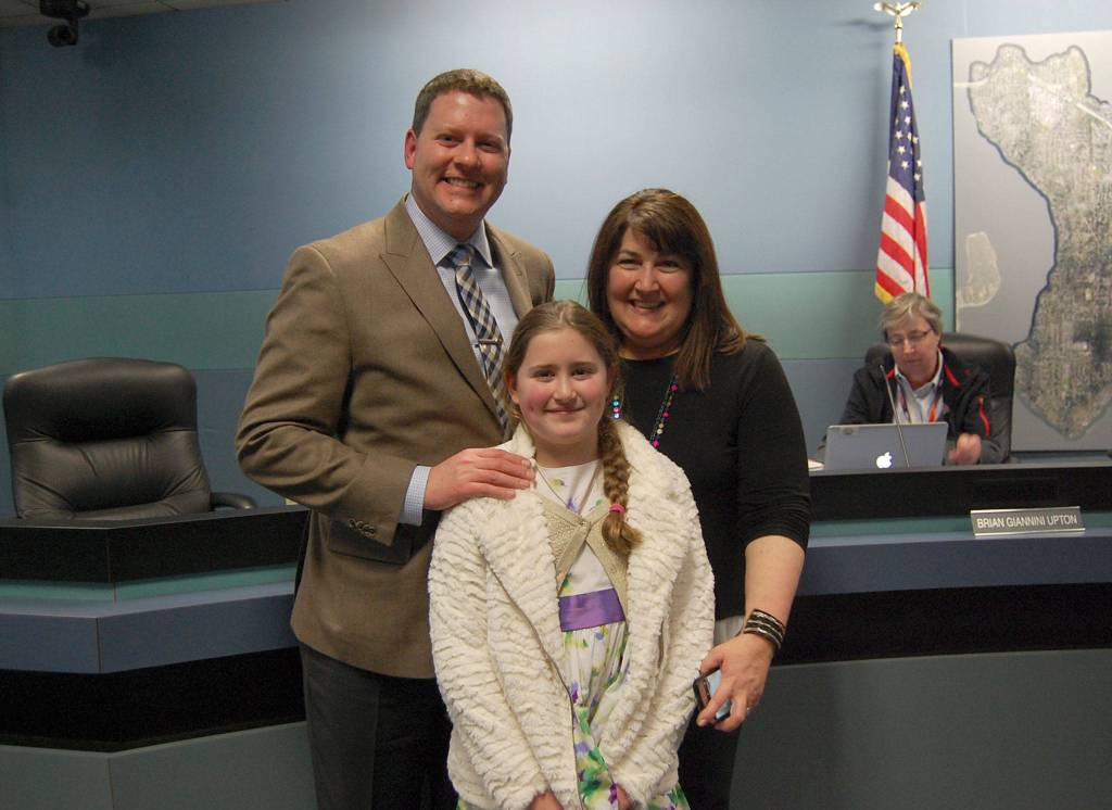 New School Board member Brian Giannini Upton poses with his family during a reception at the Dec. 14 meeting. Katie Metzger/staff photo