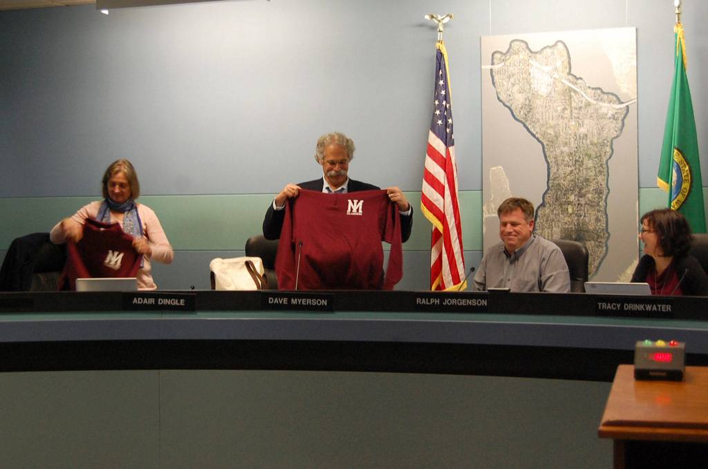 Outgoing school board members Adair Dingle and Dave Myerson receive gifts from the community on Dec. 14. Katie Metzger/staff photo