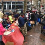 Mercer Island Cadette Girl Scout Troop 44297 members serve coffee, clementines and cookies in Pioneer Square on Dec. 25. Photo courtesy of Terese Broccoli