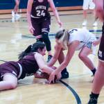 Photo courtesy of Don Borin/Stop Action Photography                                Mercer Island Islanders junior guard Angelina Barokas, left, dives for a loose ball against the Bellevue Wolverines on Jan. 3. Bellevue defeated Mercer Island 53-19 in a matchup between rivals.
