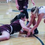 Photo courtesy of Don Borin/Stop Action Photography                                Mercer Island Islanders junior guard Angelina Barokas, left, dives for a loose ball against the Bellevue Wolverines on Jan. 3. Bellevue defeated Mercer Island 53-19 in a matchup between rivals.