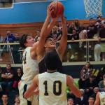 Photo courtesy of Don Borin/Stop Action Photography                                Mercer Island senior forward Giovanni Cervantes-Rocha, center, secures a rebound against the Bellevue Wolverines on Jan. 3. Bellevue defeated Mercer Island 61-57 in a matchup between rivals.