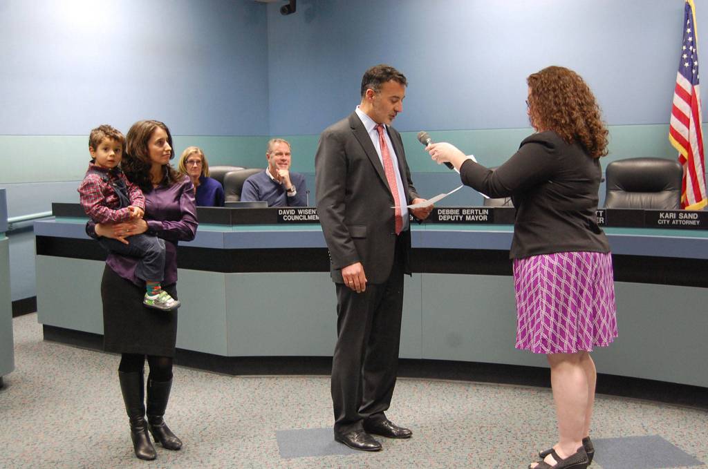 Deputy Mayor Salim Nice takes his councilmember oath of office on Jan. 9, with his family by his side. Katie Metzger/staff photo