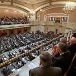 Viewers in the gallery applaud as Gov. Jay Inslee makes his annual state-of-the state address before a joint legislative session Tuesday in Olympia. (Elaine Thompson / Associated Press)