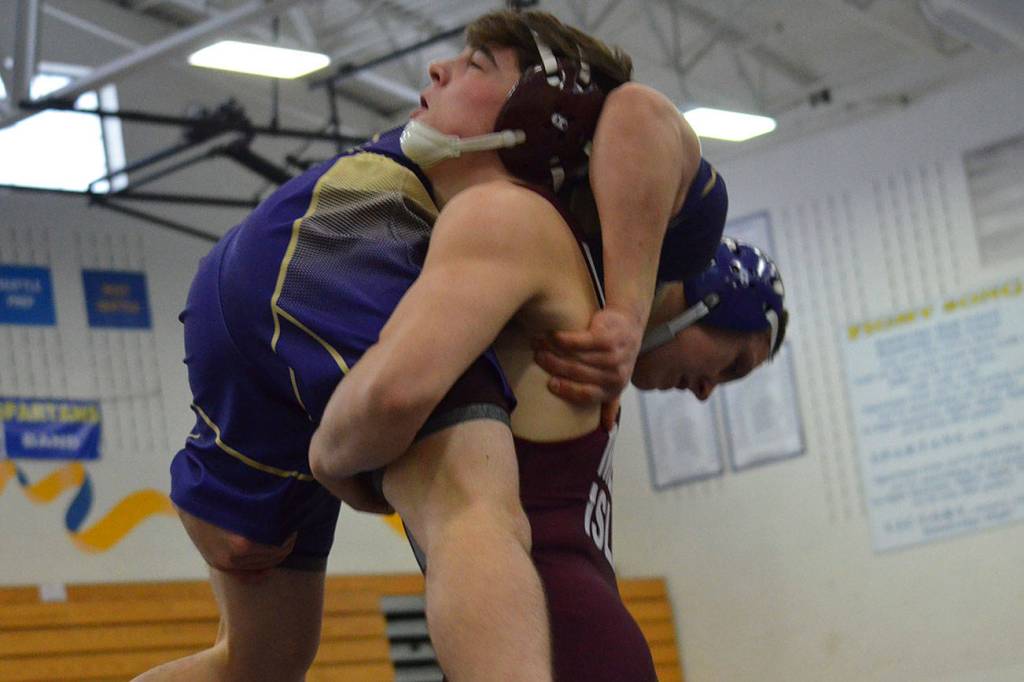 Photo courtesy of Billy Pruchno                                The Mercer Island wrestling team earned a 45-6 victory against the Bellevue Wolverines and a 57-12 victory against the Juanita Rebels on Jan. 9. Islanders wrestlers capturing victories against Bellevue consisted of Connor Pettigrew (forfeit), Jordan Tillinger (decision), Andrew Motz (pin), Eli Pruchno (pin), Vinny Ricci (pin), Jonah Andrews (forfeit), Liam Farrell (forfeit) Donnie Howard (pin) and Connor Hill (forfeit). Mercer Island grapplers registering wins against the Rebels consisted of Pettigrew (forfeit), Tillinger (decision), Motz (forfeit), Pruchno (pin), Mattias Harnay (forfeit), Ricci (pin), Andrews (pin), Farrell (forfeit), Howard (pin) and Hill (injury default). Andrews (pictured) takes down Juanita grappler 160-pounder Xavier Fontenot in a dual match.