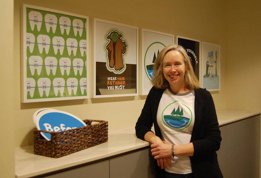 Dr. Kara McCulloch, the MIYFS 2018 Philanthropy Award winner, poses at the reception area of her practice, Orthodontic Associates of Mercer Island. Katie Metzger/staff photo