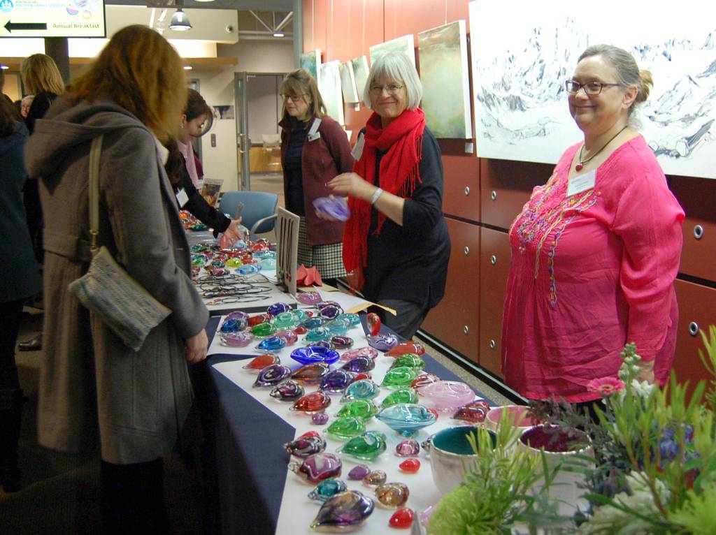 Volunteers sell glass hearts in the lobby of the Mercer Island Community and Event Center before the MIYFS Annual Breakfast. Katie Metzger/staff photo