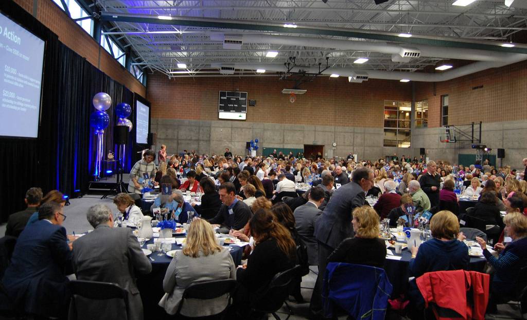 About 600 Islanders pack into the Mercer Island Community and Event Center for the MIYFS Annual Breakfast. Katie Metzger/staff photo
