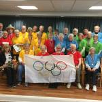 Covenant Shores residents pose for a photo after the closing ceremony of their community Olympic Games on Feb. 13. Photo courtesy of Greg Asimakoupoulos
