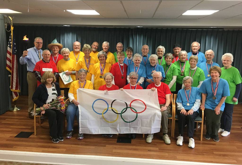 Covenant Shores residents pose for a photo after the closing ceremony of their community Olympic Games on Feb. 13. Photo courtesy of Greg Asimakoupoulos