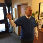 Covenant Shores Executive Director Bob Howell kicks off the torch relay for the Shores Olympics. Photo courtesy of Greg Asimakoupoulos