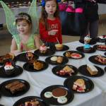 Young Islanders dressed in Disney costumes admire the dessert display. Katie Metzger/staff photo