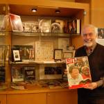 Rev. Greg Asimakoupoulos holds up a vintage Life magazine with Billy Graham on the cover. Asimakoupoulos memorabilia collection of the late famous preacher is on display at Covenant Shores Retirement Community. Katie Metzger/staff photo