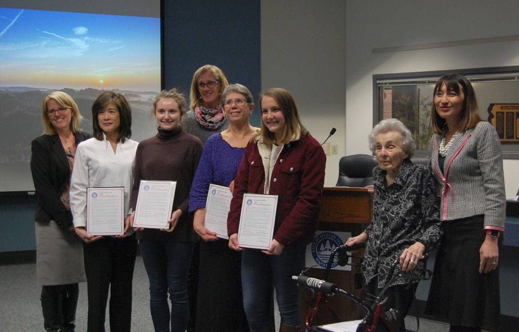 From left, Councilmember Wendy Weiker, President/CEO of Boys and Girls Clubs of King County Dr. Lisa Chin, co-President of the MIHS Gender Equality Club Dana Berejka, Mayor Debbie Bertlin, past President of the League of Women Voters of Seattle-King County Amanda Clark, Gender Equality Club co-president Julia Graham, community volunteer Myra Lupton and City Manager Julie Underwood pose with copies of the proclamation. Katie Metzger/staff photo