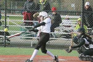 Islander Olivia Kane connects on a hit against the Sammamish Totems in a game on March 22, 2017. Courtesy of Don Borin/Stop Action Photography