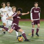 Photo courtesy of Patrick Krohn/Patrick Krohn Photography                                Mercer Island junior midfielder Dakota Promet takes a shot on goal against the Bellevue Wolverines in a KingCo 3A/2A contest on March 23 at Bellevue High School. The Islanders and Wolverines battled to a 0-0 draw.