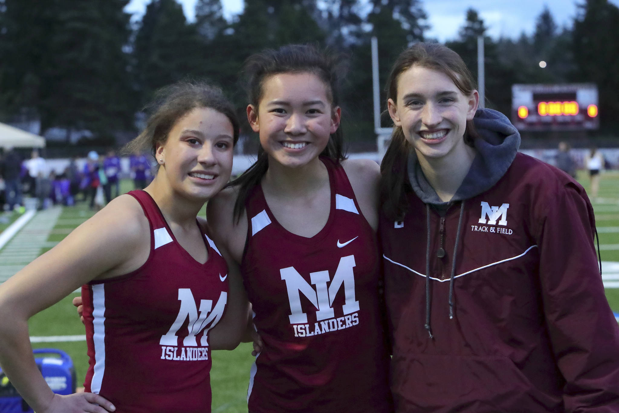 Photo courtsy of Jay Na                                The Mercer Island Islanders girls and boys track teams performed well in a double-dual meet against the Lake Washington Kangaroos and Sammamish Totems on March 21. The Islanders girls track squad earned a 98-86 win against Lake Washington and a 134-45 triumph against Sammamish.                                The Mercer Island Islanders boys track team defeated Sammamish 126-47 but lost to Lake Washington 139-34. Ashley Rudd, Maya Virdell, Kayla Lee and Maggie Baker were members of the winning girls 800-meter relay squad with a time of 1:48.34. Virdell, Lee and Baker are pictured in the above photo. Islanders girls athletes earning first place in their respective events consisted of Chloe Michaels (1600 meters, 3200 meters), Lee (200 meters, 1600-meter relay), Baker (400 meters, 1600-meter relay), Rudd (300 hurdles, 400-meter relay), Virdell (400-meter relay), Eliza Crenshaw (400-meter relay), Katie McCormick (400-meter relay), Ella Hensey (1600-meter relay, long jump), Gretchen Blohm (1600-meter relay) and Faith Osei-Tutu (shot-put). Islanders boys athletes capturing first place in their respective events were Alexander Benson (3200 meters), Jack Clayville (110 hurdles) and Jeffery Tian (pole vault).