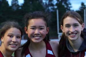 Photo courtsy of Jay Na                                The Mercer Island Islanders girls and boys track teams performed well in a double-dual meet against the Lake Washington Kangaroos and Sammamish Totems on March 21. The Islanders girls track squad earned a 98-86 win against Lake Washington and a 134-45 triumph against Sammamish.                                The Mercer Island Islanders boys track team defeated Sammamish 126-47 but lost to Lake Washington 139-34. Ashley Rudd, Maya Virdell, Kayla Lee and Maggie Baker were members of the winning girls 800-meter relay squad with a time of 1:48.34. Virdell, Lee and Baker are pictured in the above photo. Islanders girls athletes earning first place in their respective events consisted of Chloe Michaels (1600 meters, 3200 meters), Lee (200 meters, 1600-meter relay), Baker (400 meters, 1600-meter relay), Rudd (300 hurdles, 400-meter relay), Virdell (400-meter relay), Eliza Crenshaw (400-meter relay), Katie McCormick (400-meter relay), Ella Hensey (1600-meter relay, long jump), Gretchen Blohm (1600-meter relay) and Faith Osei-Tutu (shot-put). Islanders boys athletes capturing first place in their respective events were Alexander Benson (3200 meters), Jack Clayville (110 hurdles) and Jeffery Tian (pole vault).