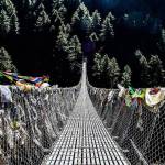 A suspension bridge on the way to Mt. Everest base camp in Nepal. It is one of the last checkpoints before arriving in Namche Bazaar, a town cut into the side of a mountain at 11,286ft. Tony Michaels Photography