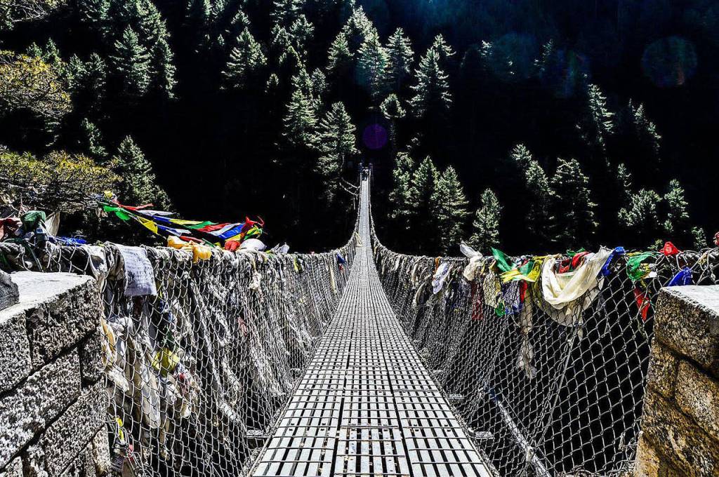 A suspension bridge on the way to Mt. Everest base camp in Nepal. It is one of the last checkpoints before arriving in Namche Bazaar, a town cut into the side of a mountain at 11,286ft. Tony Michaels Photography